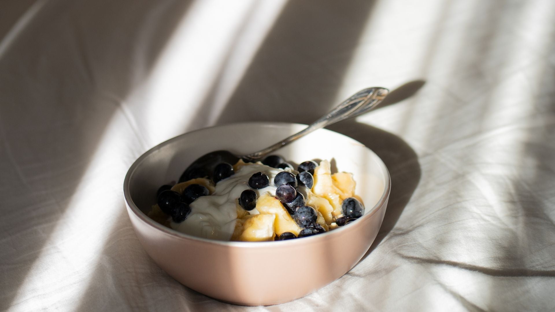daily planner on desk with a cup of coffee and a pen