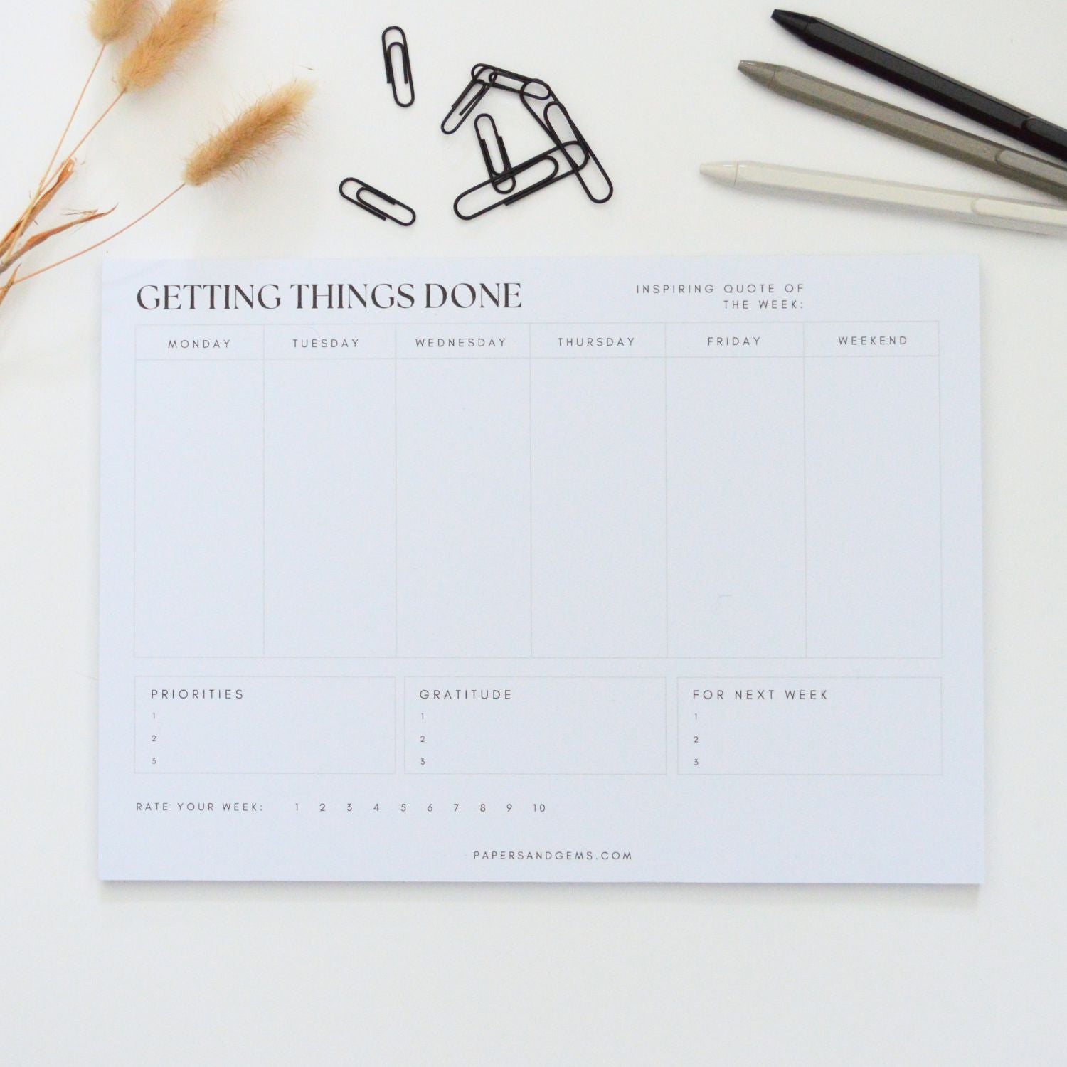 a4 weekly planner pad on desk