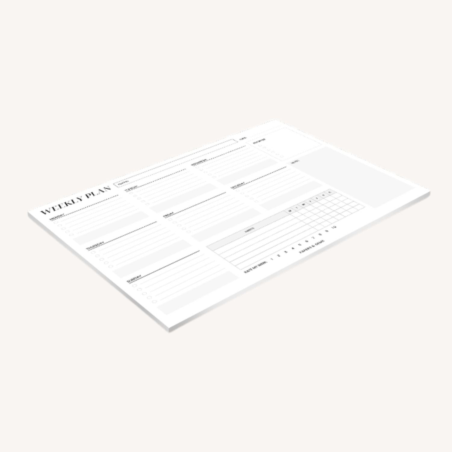 Weekly planner pad side view on a plain background