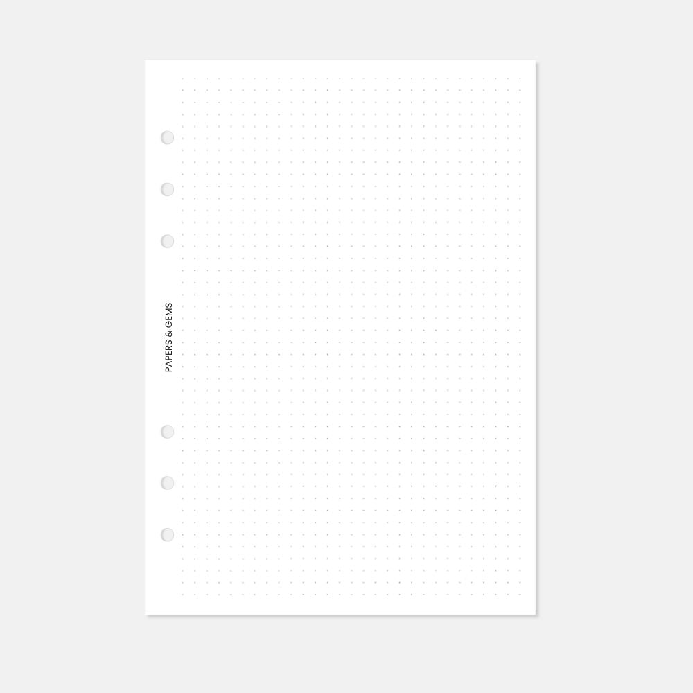 A5 Planner inserts dotted paper pages with six punched holes on a white background
