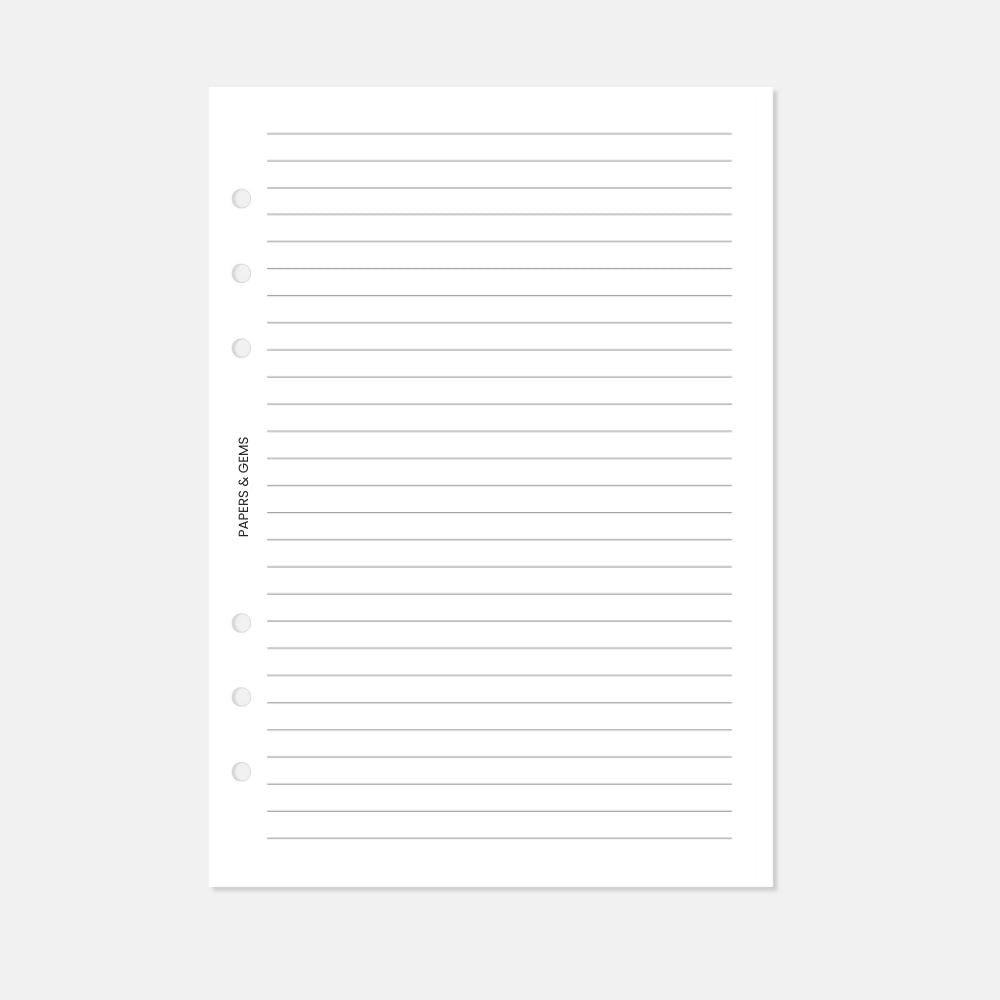 A5 Planner inserts lined paper pages with six punched holes on a white background