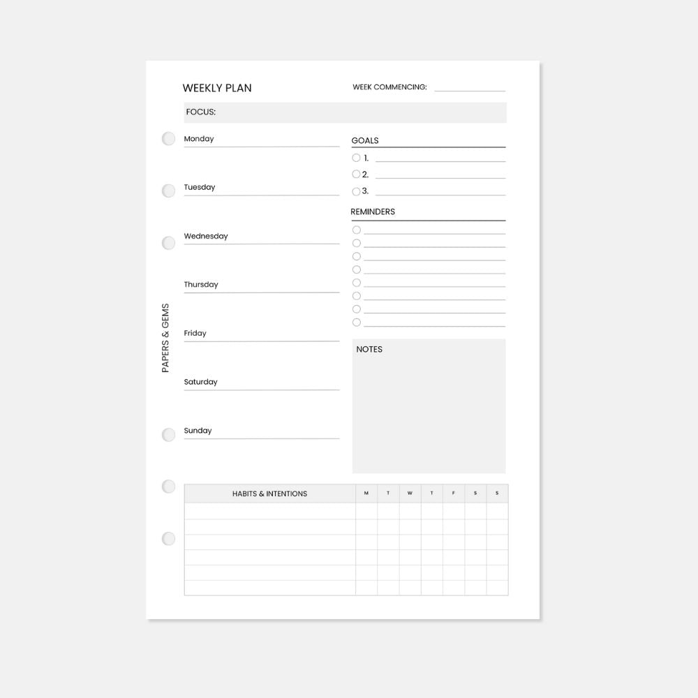 A5 Weekly planner insert white pages with six punched holes on a white background