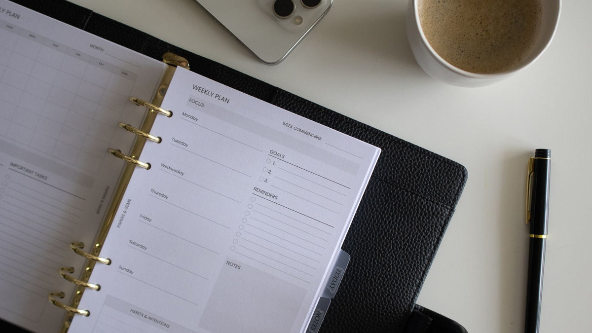 black A5 binder planner on desk